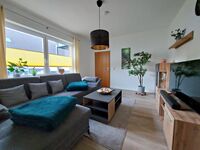 Behagliches WZ mit großem Fernseher Behagliches WZ mit großem Fernseher