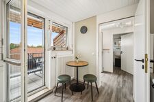 Kleiner Sitzbereich und Zugang zum Balkon Kleiner Sitzbereich und Zugang zum Balkon
