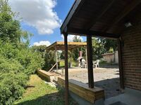 Garten mit überdachtem Grillplatz Garten mit überdachtem Grillplatz