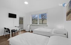 Schlafzimmer 3 mit zwei Einzelbetten, Sitzecke und Smart TV Schlafzimmer 3 mit zwei Einzelbetten, Sitzecke und Smart TV