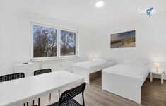 Schlafzimmer 3 mit zwei Einzelbetten, Sitzecke und Smart TV Schlafzimmer 3 mit zwei Einzelbetten, Sitzecke und Smart TV
