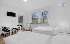 Schlafzimmer 3 mit zwei Einzelbetten, Sitzecke und Smart TV Schlafzimmer 3 mit zwei Einzelbetten, Sitzecke und Smart TV