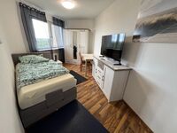 1‑Bett-Zimmer 1‑Bett-Zimmer