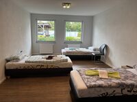 Schlafzimmer mit drei Einzelbetten Schlafzimmer mit drei Einzelbetten