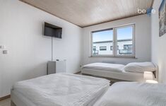 Schlafzimmer 2 mit zwei Einzelbetten, Sitzecke und Smart TV Schlafzimmer 2 mit zwei Einzelbetten, Sitzecke und Smart TV