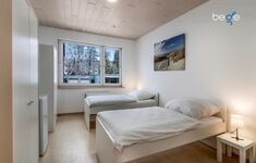Schlafzimmer 3 mit zwei Einzelbetten, Sitzecke und Smart TV Schlafzimmer 3 mit zwei Einzelbetten, Sitzecke und Smart TV