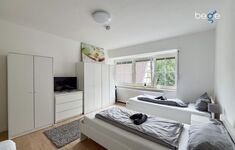 Schlafzimmer 2 mit zwei Einzelbetten, Sitzecke und Smart TV Schlafzimmer 2 mit zwei Einzelbetten, Sitzecke und Smart TV