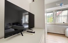 Schlafzimmer 1 mit zwei Einzelbetten, Sitzecke und Smart TV Schlafzimmer 1 mit zwei Einzelbetten, Sitzecke und Smart TV