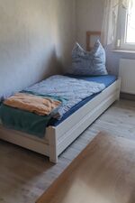 Bett in dem Einzelzimmer Bett in dem Einzelzimmer
