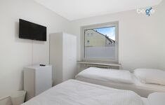 Schlafzimmer 3 mit zwei Einzelbetten, Sitzecke und Smart TV Schlafzimmer 3 mit zwei Einzelbetten, Sitzecke und Smart TV