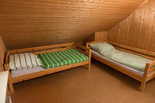 Kinderzimmer mit zwei Einzelbetten im OG Kinderzimmer mit zwei Einzelbetten im OG