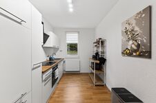 Wohnung 1: Große, voll ausgestattete Küche mit Herd, Backofen, Mikrowelle und viel Platz zum Kochen. Wohnung 1: Große, voll ausgestattete Küche mit Herd, Backofen, Mikrowelle und viel Platz zum Kochen.