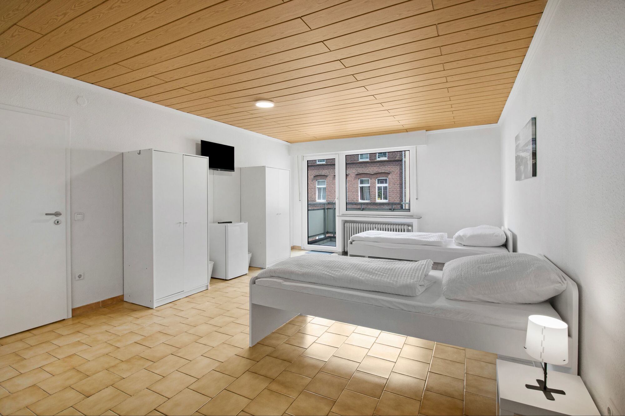 Schlafzimmer 1 mit zwei Einzelbetten, Sitzecke und Smart TV Schlafzimmer 1 mit zwei Einzelbetten, Sitzecke und Smart TV