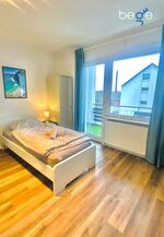 Schlafzimmer 2 mit zwei Einzelbetten, Sitzecke und Smart TV