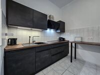 Alpha Apartments: Mehrere Moderne Einheiten | 2BR, 4 Beds Bild 1