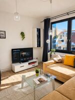 Wohnzimmer mit Schlafsofa 