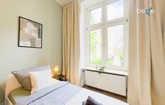 Schlafzimmer 3 mit zwei Einzelbetten, Sitzecke und Smart TV 