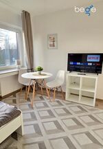 Schlafzimmer 2 mit zwei Einzelbetten, Sitzecke und Smart TV