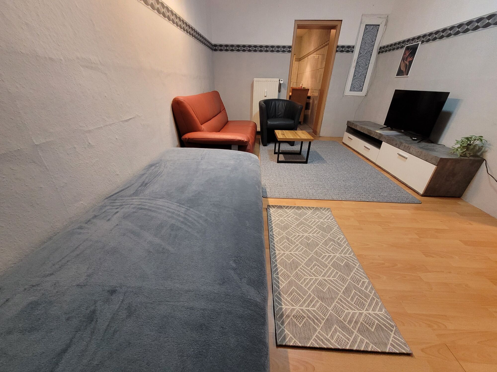 Wohnzimmer mit 1 Bett