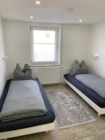 Schlafzimmer mit getrennte Betten.