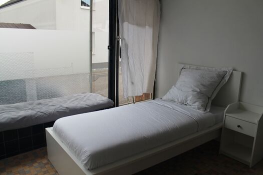 Schlafzimmer 3 mit großem Fenster und relax Area
