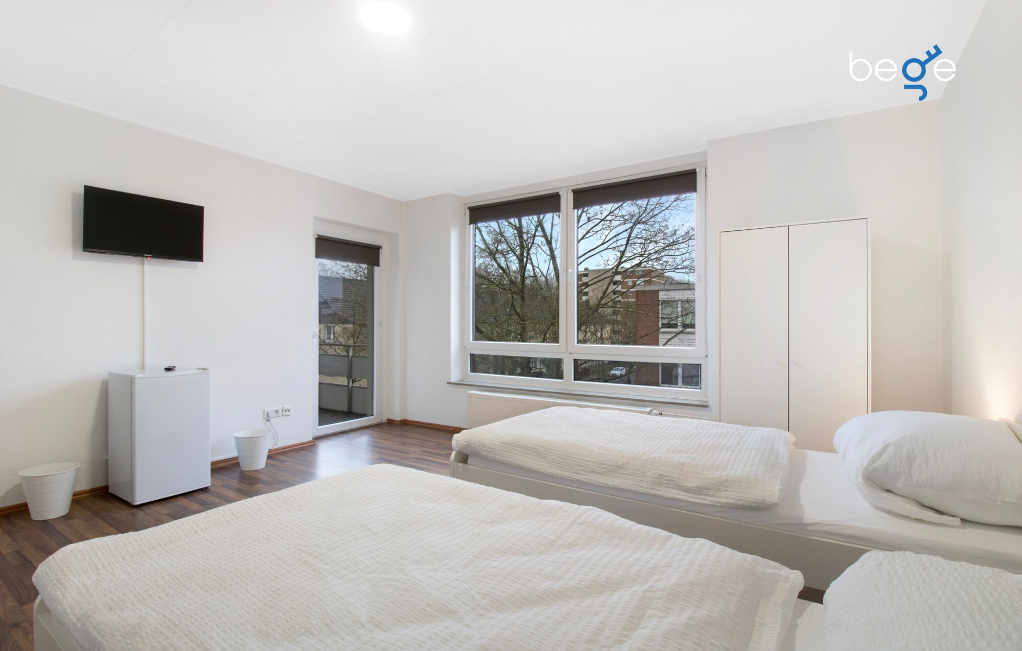 Schlafzimmer 1 mit zwei Einzelbetten, Sitzecke und Smart TV