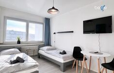 Schlafzimmer 3 mit zwei Einzelbetten, Sitzecke und Smart TV