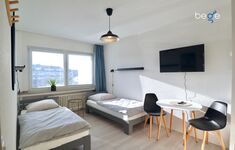 Schlafzimmer 3 mit zwei Einzelbetten, Sitzecke und Smart TV