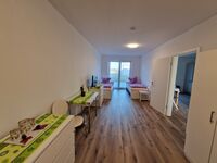 Monteurwohnung RoomWork24 – 10 Betten | Parkplatz Bild 24